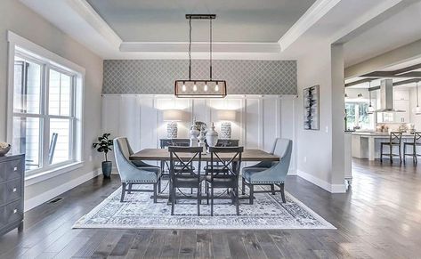 Dining room with gray tray ceiling and wood flooring and white wall paneling Tray Ceiling Paint Ideas, Tray Ceiling Ideas, Kitchen Dining Room Combo, White Wall Paneling, Open Living Room Design, Grey Ceiling, High Ceiling Living Room, Ceiling Design Ideas, Home Bar Design