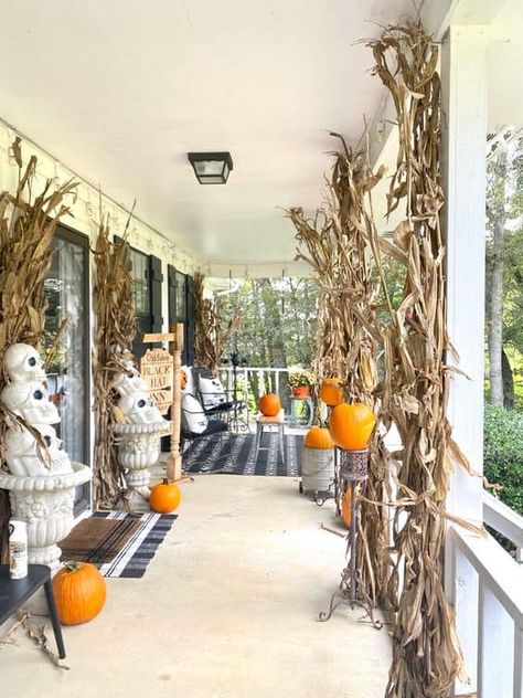 20 Blended Fall and Halloween Decor Ideas » Lady Decluttered Corn Stalk Porch Decor, Corn Stalk Decorations Front Porches, Decorating With Corn Stalks, Corn Stalks Front Porch, Corn Stalks Decorations, Fall And Halloween Decor Ideas, Fall Mailbox Decor, Corn Stalk Decor, Fall Festival Decorations