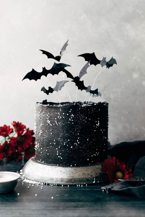 This black velvet cake has a flavor that is rich, deep, and not too sweet. It's also super moist and its dark color makes it the perfect Halloween cake! Decorate with black cocoa buttercream, white star splatters, and flying bats to make it even more festive. #halloween #halloweencakes #blackvelvetcake #cakedecorations #butternutbakery | butternutbakeryblog.com Black Velvet Cake, Black Velvet Cakes, Halloween Cake Recipes, Bat Cake, Butternut Bakery, White Food Coloring, Spooky Cake, Halloween Birthday Cakes, Halloween Cake Decorating