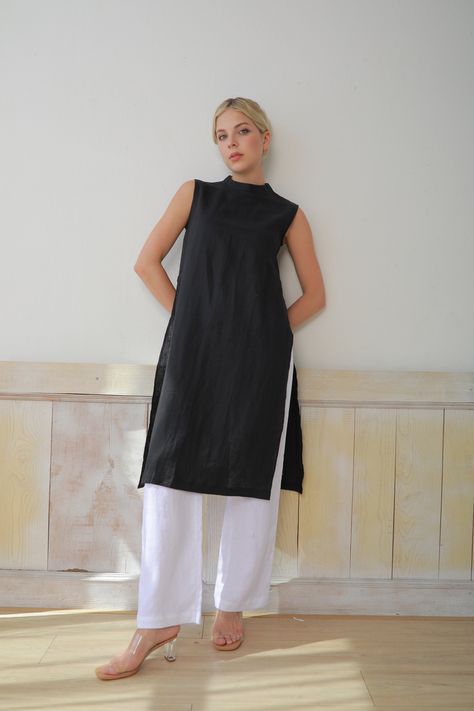 Our linen ao dai tunics are for those who love the simple, rustic beauty of linen and sustainable fashion. The ao dai has a relaxed fit and is made of soft, breathable pure linen. You can easily pair it with linen, cotton, and khaki pants, or jeans pants for a younger and more modern look. Perfect for special occasions and ceremonies. Handmade in our studio to your own measurements and wishes, with a wide range of color options. ✓DETAILS - Relaxed fitting - No front waist seams - Sleeveless - Modern look - Pants: loose fit with wide legs, front zipper and elastic band in back for flexibility, two side inseam pockets. Very versatile, easy to combine with other tops for a more casual look.  - 100% linen, medium weight, free-shrinkage. All our linen is pre-washed for an amazingly soft feel. - Linen Tops Women, Tunic With Pants, Linen Kaftan, Tunics For Women, Kaftan Tunic, Sleeveless Tunic Tops, Linen Tunic Tops, Tunic Designs, Vietnamese Dress