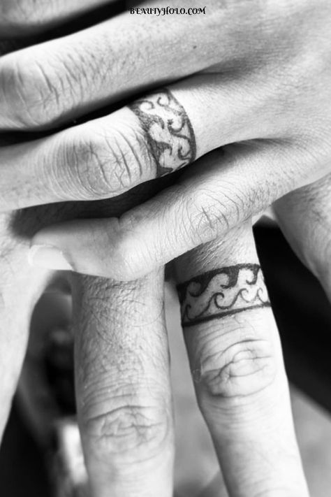 Wedding Ring Tattoos: A Timeless Symbol of Everlasting Love. Explore unique designs and meaningful expressions of commitment. Find inspiration for your own ring tattoo here. #weddingringtattoos #lovesymbol #ringtattoos Marriage Ring Tattoos, Wedding Ring Tattoo For Men, Jacob Tattoo, Wedding Ring Tattoos, Tattoo Rings, Ring Tattoo Designs, Wedding Band Tattoo, Tattoo Wedding, Ring Tattoo