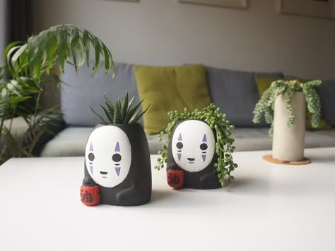 No face plant pot can be a great gift to any Studio Ghibli fan. Size: Height: 10.5cm / 4.13 inches Diameter:  8cm / 3.14 inches Diameter of the hole: 5.5 cm / 2.16 inches Depth of the hole: 7 cm / 2.76 inches The bottom of the No face Ghibli pot covered with cork to prevent scratching and damaging surfaces. Concrete is a raw natural material and due to this, it will never set exactly the same way handmade concrete items will have air bubbles and have slight colour differences as they are not factory made making each one fully unique. If requested the item will be hand painted by me. Visit my shop for more items: goblincraftlondon.etsy.com All items are cured and water sealed before posting for maximum longevity and durability. The items are hand painted by me. * please allow 1 - 3mm discre Cute Pot Plants, Ghibli Plant Pot, Studio Ghibli Decorations Party, Ghibli Wedding Theme, Ghibli Plant, Studio Ghibli Gifts, Studio Ghibli Themed Room, Studio Ghibli Ceramics, Studio Ghibli Pottery