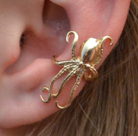 "This is our new Steampunk  Ear Cuff \"The Octopus\". It is very detailed and will make a bold statement on your ear! This Ear Cuff is non pierced and hugs your ear comfortably and securely. It is made of 14K Gold Vermeil or Sterling Silver , and is available in a right or a left side or a pair.  This piece will arrive in a Gift Box and include simple fitting instructions. Perfect for gift giving"