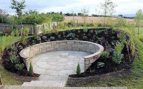 A paved, walled sunken garden behind an earth bank to enjoy the sun when things get too windy on the decking.   | Sunken circle Windy Garden Ideas, Sunken Garden Ideas, Circle Garden Design, Recessed Patio, Sloped Backyard Landscaping Ideas, Garden Circle, Steep Gardens, Sloped Backyard Landscaping, Garden Seating Area