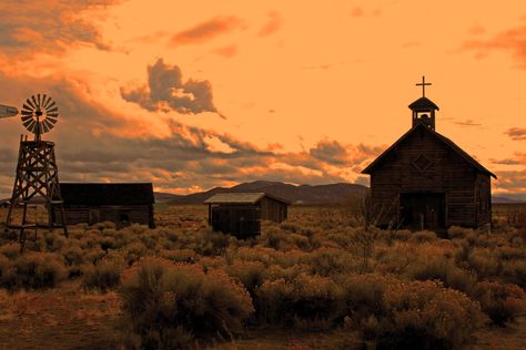 Image chosen to depict possible environmental features/decoration, here a windmill and a church and outhouses. Gothic Western Wallpaper, Wild Western Aesthetic, Wild West Women Aesthetic, Old West Aesthetic, Cowboy Vampire, Wild West Buildings, Dark Western, Gothic Western, Cowboy Aesthetic