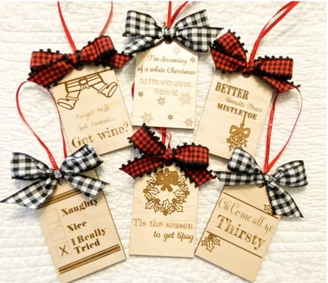 These wine tags will be perfect to hang on your tree or gift to family and friends. Tags are made out of mahogany wood and laser engraved. Ribbon will vary based on availability. Wine Tags Diy, Laser Cut Ornaments, Santa Cam Ornament, Diy Laser Engraver, Wine Bottle Gift Tags, Wine Gift Tags, Wood Laser Ideas, Bottle Gift Tags, Wine Bottle Tags