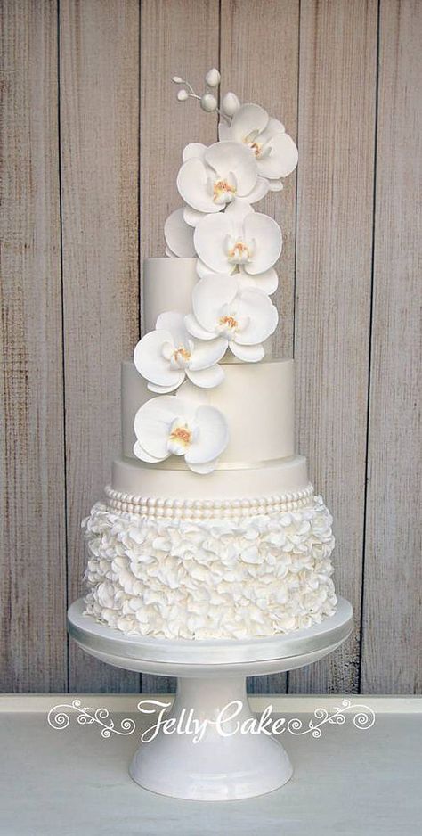 Orchid Ruffles Wedding Cake | An all white cake with a botto… | Flickr All White Cake, Ruffles Wedding Cake, Orchid Wedding Cake, Orchid Cake, Ruffle Wedding Cake, Dream Wedding Cake, Romantic Wedding Cake, Tiered Cake, Orchid Wedding