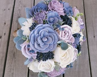 Dusty Blue And Lavender Wedding, Blue And Lavender Wedding, Wooden Bouquet, Bouquet Dusty Blue, Wedding Flower Alternatives, Fake Wedding Flowers, Wooden Flower Bouquet, Lavender Wedding Bouquet, Blue Purple Wedding