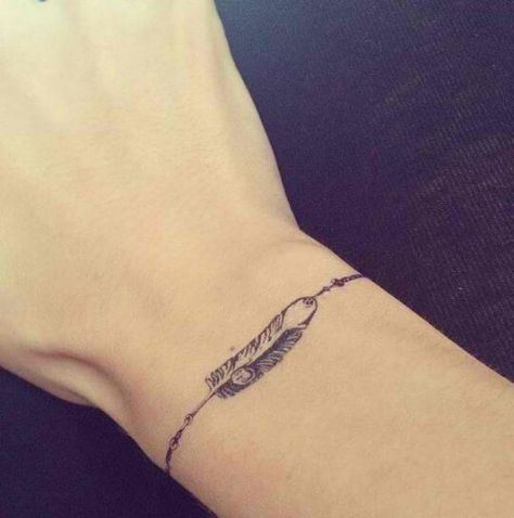 Feather bracelet for soft and subtle look Feather Tattoo Wrist, Noir Tattoo, Wrist Bracelet Tattoo, Tattoo Band, Bracelet Tattoo, Tato Henna, Armband Tattoos, Anklet Tattoos, Wrist Tattoos For Women