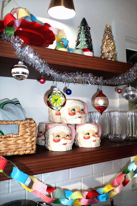 Vintage Santa mugs, disco balls, and tinsel? Sign us up for a stunning colorful kitschy Christmas! #vintagechristmas #nostalgicholidaydecor #kitschychristmas #bhg Kitsch Christmas Aesthetic, Maximalist Christmas Aesthetic, Kitschy Christmas Diy, Kitsch Interior Design, Kitschy Christmas Decor, Holiday Decor Aesthetic, Vintage Santa Mugs, Disco Chic, Kitsch Cat