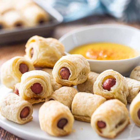 Pigs in a Blanket: Mini hot dogs wrapped in an easy homemade puff pastry. So flaky and buttery, with a sweet & tangy honey mustard dipping sauce. Perfect party app! #pigsinablanket #crescentrolls #recipe #easy #foracrowd #withhotdogs #puffpastry #dippingsauce #mini #christmas #sides #sausage #grownup #forkids #howtomake #dinner #fancy #homemade #fromscratch #babyshowerfood #halloween #football #meal #pizzadough #holiday #appetizer #gourmet #best #party #sauce #withchili #platter #hotdogs #thanks Pigs In A Blanket Puff Pastry, Easy Homemade Puff Pastry, Pigs In A Blanket Recipe, Easy Puff Pastry Recipe, Homemade Puff Pastry, Mini Hot Dogs, Honey Mustard Dipping Sauce, Mustard Dipping Sauce, Easy Puff Pastry