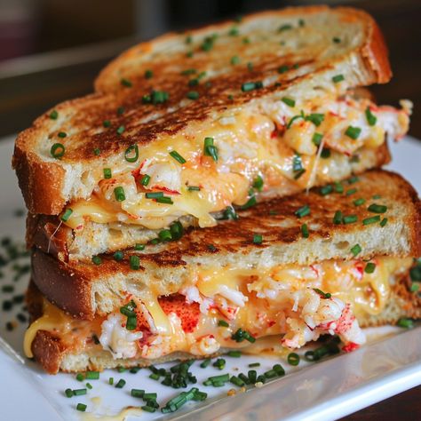 🦞 Savor the luxurious taste of our Kennebunkport Lobster Grilled Cheese! 🦞🧀 #LobsterLove #GourmetSandwich Kennebunkport Lobster Grilled Cheese Ingredients: Cooked lobster meat, chopped (1 cup) Sliced bread (4 slices) Butter (2 tbsp) Cheddar cheese, shredded (1 cup) Garlic powder (1/2 tsp) Lemon zest (1 tsp) Fresh chives, chopped (1 tbsp) Salt (1/2 tsp) Instructions: Combine lobster, garlic powder, lemon zest, and chives. Butter one side of each bread slice. Place buttered side down in a s... Lobster Grilled Cheese, Lobster Grilled, Cooked Lobster, Seafood Sandwiches, Coastal Luxury, Gourmet Grilled Cheese, Gourmet Sandwiches, Instagram Recipes, How To Cook Lobster