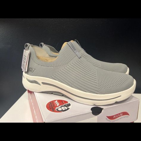 Elevate Your Casual And Fashion Style With These Skechers Women's Gray Sneakers. The Skechers Go Walk Arch Fit Iconic Sneaker Will Make Every Walk A Comfortable One With A Stretch Knit Fabric Upper, Slip-On Entry, And A Machine Washable Design. Woven-In Knit Textured Panels At Toe, Heel, And Instep Panel For Added Structure. Rear Pull-Tab Offers Easy Entry. Tonal Collar And Heel Panel. Signature Logo Accents At The Side Panel And Heel Stripe. Breathable Fabric Lining. Lightweight, Responsive Ult Sketchers Go Walk, Gray Sneakers, Skechers Go Walk, Textured Panels, Grey Sneakers, Skechers Women, Skechers Shoes, Pull Tab, Signature Logo