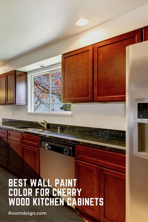 Check out the best wall paint color for cherry wood kitchen cabinets based on our experiment. Bathroom Ideas With Cherry Wood Cabinets, Kitchen Paint Colors With Cherry Cabinet, Wall Colors With Cherry Cabinets, Brown Kitchen Walls, Cherry Cabinets Kitchen Wall Color, Paint Color Ideas For Kitchen, Cherry Cabinet Kitchen Color Scheme, Kitchen White Walls, Cherry Cabinet Kitchen