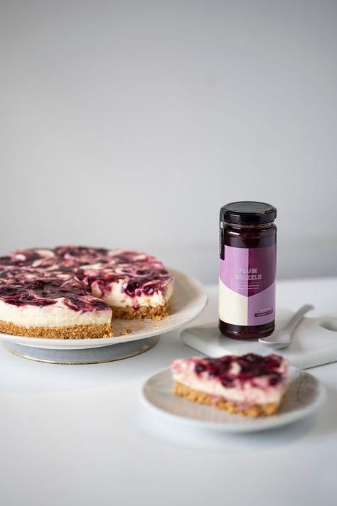 Indulge in this creamy no-bake cheesecake, elevated by the sweetness of condensed milk and crowned with a swirl of our deliciously tangy plum drizzle. A simple set-and-forget dessert which is sure to be a crowd pleaser! Plum Cheesecake, Bake Cheesecake, No Bake Cheesecake, Food Shows, Celebrity Chefs, Crowd Pleaser, Cake Tins, Special Recipes, Condensed Milk