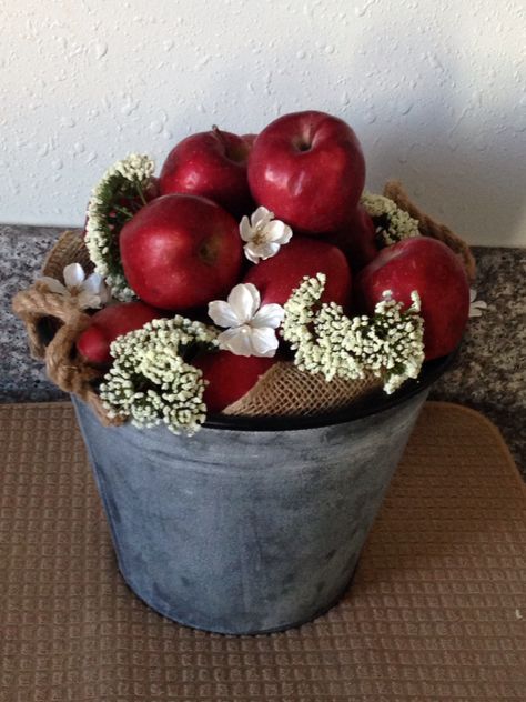 Apple inspired center piece #apple #centerpiece Apples Centerpiece, Apple Mantle Decor, Apple Tree Centerpieces, Red Apple Centerpiece Ideas, Apples In Vases Centerpieces, Apple Centerpiece Ideas, Fall Apple Centerpieces, Apple Basket Decor, Apple Of Our Eye Baby Shower Decor