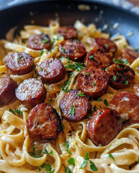 Emily Recipes - Garlic Butter Sausage Bites with Creamy... Garlic Butter Sausage Pasta, Andouille Pasta Recipes, Garlic Butter Sausage Bites, Smoked Sausage And Pasta Recipes, Tortellini And Sausage Recipes, Smoked Sausage Pasta Recipes, Kielbasa Recipes Pasta, Pasta And Sausage Recipes, Garlic Butter Sausage