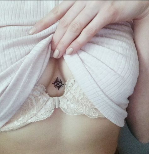 Tiny underboobs tattoo Small Evil Eye Sternum Evil Eye Tattoo, Evil Eye Tattoo Sternum, Sternum Eye Tattoo, Evil Eye Chest Tattoo, Chest Tattoo Eye, Ignorant Tattoo, Arabic Tattoos, Birthday Tattoos, Sternum Tattoos