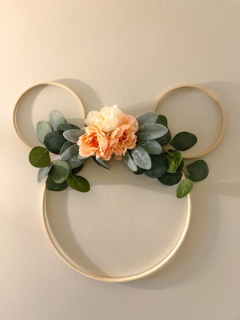 DIY minnie mouse inspired hoop wreath.  I found everything at HobbyLobby. All the floral was found in the wedding section(which was on a %50 off sale and cheaper than buying it in the regular floral section) and the cost was probably around $15. I plan to use it for decoration at my two-year-old‘s birthday party and later will hang it in her room. Minnie Floral Wreath, Diy Minnie Birthday, Boho Minnie Mouse Room, Minimalist Minnie Mouse Party, Minnie Mouse Room Decor Diy, Minnie Mouse Floral Birthday Party, Two Year Old Minnie Birthday Party, Floral Minnie Mouse Party, Boho Minnie Mouse Birthday Party Ideas