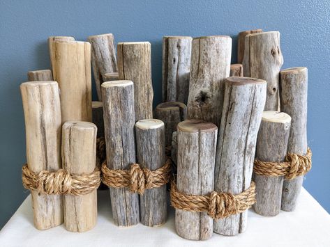 "Decorate your home with this unique nautical or lake themed driftwood piling decor with options of added bobbers! I took genuine driftwood branches from the shores of the Tennessee river and cut them into three sizes of piling pieces. Then I sanded the ends and edges to make them smooth and splinter free, but not too much so as to deplete the natural look! Then I glued them together in a bunch and wrapped natural color jute rope around, securing it firmly. I have not sealed it with any clear co Nautical Rope Decor, Nautical Table Decor, Nautical Outdoor Decor, Lake Theme, Beach Wall Hanging, Nautical Table, Nautical Crafts, Fish Wall Decor, Lake Decor