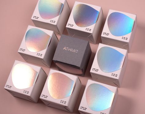 ATHMO – Packaging Of The World Iridescent Packaging, Hologram Packaging, Futuristic Packaging, Translucent Packaging, Chrome Packaging, Luxury Candles Packaging, Crystal Packaging, Small Messages, Index Design