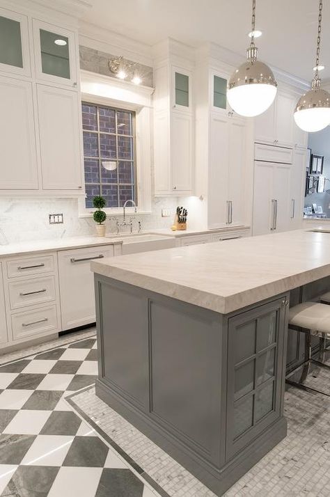 White and gray kitchen with a black and white checkered floor featuring a gray island with frosted glass cabinets and a gray marble countertop. Black And White Checkered Floor, Checkered Floor Kitchen, White And Gray Kitchen, Checkered Floor, Gray Island, Black White Kitchen, White Marble Floor, Blue Ceilings, Floor Kitchen