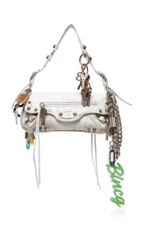 Find BALENCIAGA Le Cago Charm-detailed Leather Shoulder Bag Os on Editorialist. The Balenciaga Le Cago bag is crafted from extra-supple lambskin leather and features a rectangular shape adorned with charms and hardware. The bag has aged silver hardware that is a signature element of the Balenciaga Neo Classic City styles. White Purses, Fancy Bags, Balenciaga Bag, Mode Inspo, Balenciaga City Bag, Cute Bags, Everyday Bag, Bags Designer Fashion, White Bag