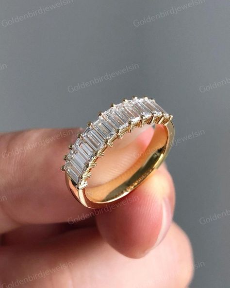 Baguette-Cut Moissanite Diamond Band, Dainty Half Eternity Wedding Band, 14K Yellow Gold Stackable Band, Promise Band, Handmade Jewelry ✥ 𝐌𝐚𝐭𝐜𝐡𝐢𝐧𝐠 𝐁𝐚𝐧𝐝 𝐃𝐞𝐭𝐚𝐢𝐥𝐬 ↣ Shape: Baguette Cut ↣ Type: Moissanite/CZ Diamond ↣ Total Weight: 2.5 Ct (App.). ↣ Color: Colorless ↣ Clarity: VVS ↣ Making Process: Handmade - Crafted by our experienced team ↣ Options: Lab Grown Diamond and Natural Diamond (Possible on request while placing an order and Extra Chargeable Service) ✥ 𝐑𝐢𝐧𝐠 𝐃𝐞𝐭𝐚? Emerald Anniversary Ring, Emerald Cut Wedding Band, Promise Band, Moissanite Band, Half Eternity Wedding Band, Unique Bands, Yellow Gold Wedding Band, Gold Anniversary, Matching Wedding Bands