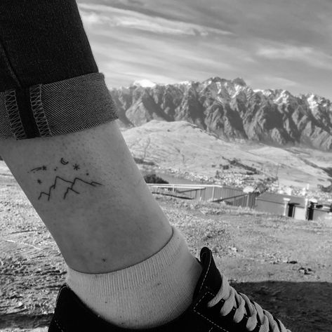 Mountains tattoo in Queenstown, NZ Simple Tattoos Mountain, Small Tattoo Mountain Simple, Nc Mountains Tattoo, Tiny Tattoo Mountain, Dainty Tattoos Mountains, Norway Inspired Tattoos, Nz Tattoo, Alaska Tattoo Ideas, Nz Tattoo Ideas