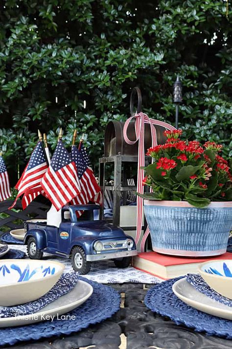 July 4th Patio Tablescape - See how to create a tablescape using vintage items, and flowers, with mix of patriotic red, white and blue. How to decorate with American flags. Summer Tablescapes, Blue Patio, American Flags, 4th Of July Decorations, Patriotic Decorations, How To Decorate, July 4th, Beautiful Decor, Red White And Blue