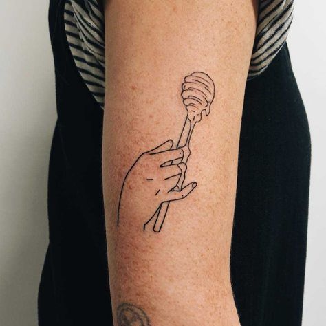 A tattoo of a hand holding a honey dipper tattoo on the right arm Tattoo Of A Hand, Honey Pot Tattoo, Dipper Tattoo, Pot Tattoo, Honey Tattoo, Related Tattoos, Stick Tattoo, Cage Tattoos, Belly Tattoos