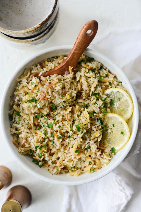 Greek Lemon Rice Pilaf is a flavorful pasta and rice side dish. Toasted orzo and rice cook with garlic and onions simmer in broth before being tossed with minced parsley, lemon zest and juice. This simple, one-pot rice and pasta dish is easy, versatile and goes with just about everything. Like any good recipe, it starts […] Parsley Rice Recipe, Lemon Rice Pilaf, Rice Pilaf With Orzo, Greek Rice Pilaf, Toasted Orzo, Greek Rice, Greek Lemon Rice, Basmati Rice Recipes, Cypriot Food