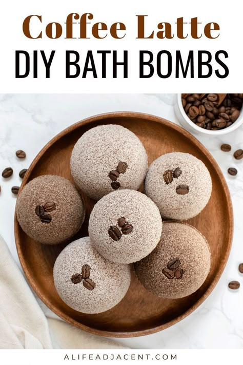 Coffee latte DIY bath bombs arranged on wooden plate, garnished with coffee beans. Text overlay: coffee latte DIY bath bombs. Coconut Milk Latte, Bath Boms Diy, Coffee Bath, Diy Bath Bomb, Coffee Essential Oil, Bath Boms, Bath Bomb Ingredients, Homemade Beauty Recipes, Bombe Recipe