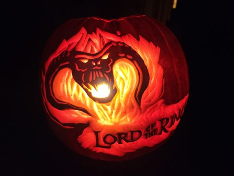 Balrog demon face wreathed in flames with Lord of the Rings text Lord Of The Rings Jack O Lantern, Pumpkin Carving Ideas Lord Of The Rings, Lord Of The Rings Pumpkin Carving, Lord Of The Rings Pumpkin, The Fellowship Of The Ring, Amazing Pumpkin Carving, Pumpkin Carvings, Fellowship Of The Ring, The Ring