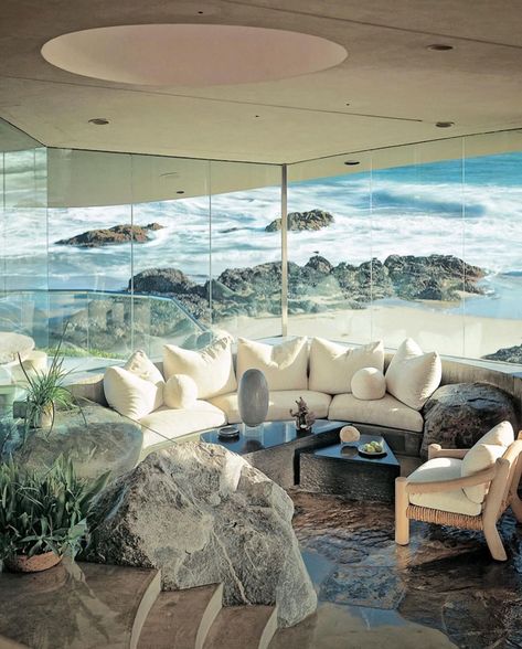 Beyer House by John Lautner Lechuza Point, Malibu — 1975 Fun fact: In collaboration with interior designer Michael Taylor, Lautner thoughtfully placed colossal granite boulders, weighing anywhere from 3 to 21 tons each, around the house. The task of moving these rocks from a riverbed located in Central California proved to be an extensive and expensive operation. Of the 125 rocks that were transported, only the finest 20 were chosen to decorate the house. 📸 Photos by @timstreetporter @brad... West Coast California, Monochromatic Room, Michael Taylor, John Lautner, City Of Dreams, Seaside Living, Geometric Cushions, Coastal Life, Central California