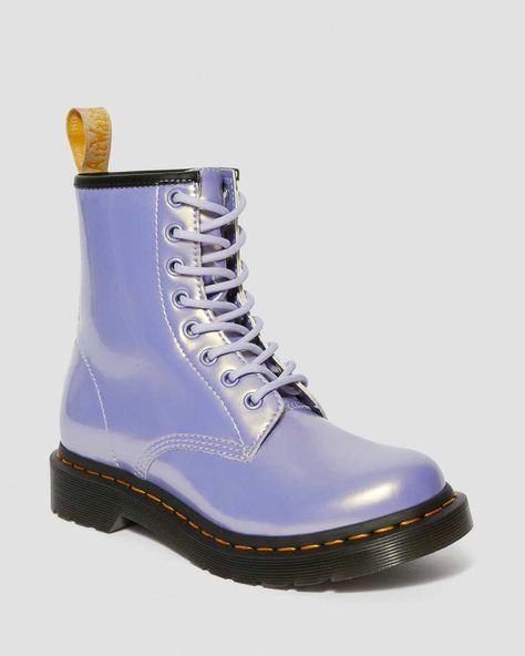 Demand attention in our new opalescent Vegan boot. The 1460 Vegan Opaline is free from leather but packed with Docs DNA. Instantly recognisable with a yellow welt stitch and grooved edges — the scripted heel loop and sock liner mark the boots as vegan. Born on 1/4/60. Named the 1460. Over six decades, our 8-eye boot has become Iconic Opaline is a vegan-friendly synthetic material with a high shine patent effect and subtle shimmering colour-shift effect Our Goodyear-welted lines are heat-sealed Red Doc Martens, Galaxy Converse, Galaxy Vans, Doc Martens Outfit, Doc Martens Boots, Purple Heather, Vegan Boots, Boots Uk, Shoe Company