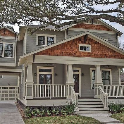 Design3 Houston on Instagram: “Arts and Crafts style home with signature cedar shake shingles in the gable. The wide base with taper columns and transom windows are part…” Craftsman With Cedar Shakes, Cedar Shake Shingles Exterior, Cedar Shake Craftsman House, Shake Shingles Accent, Cottage With Cedar Shakes, Craftsman Style Homes Exterior Color Cedar Shakes, Partial Cedar Shake Siding, House With Shakes And Siding, Cedar Shaker House Exterior