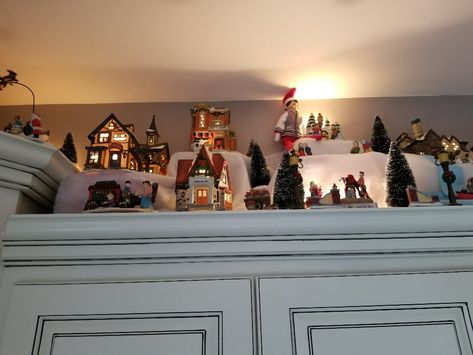 Kitchen Christmas Decorations, Christmas House Tour, Village Ideas, Christmas Village Sets, Above Kitchen Cabinets, Above Cabinets, Kitchen Christmas, Christmas Village Display, Village Display