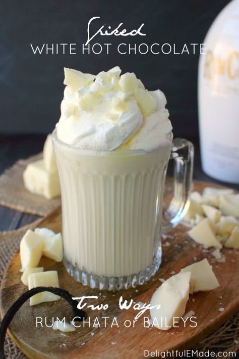 If you're a fan of Rum Chata or Bailey's, you're gonna LOVE this Spiked White Hot Chocolate!  Homemade hot chocolate made with just a few simple ingredients, along with your choice of your favorite creamy liqueur!  Topped with whipped cream, white chocolate chunks and caramel this cocktail is decadent and delicious!  | Delightful E Made Rumchata Recipes Drink, Pinterest Drink, Hot Chocolate Ideas, Baileys Hot Chocolate, Rumchata Recipes, Rum Chata, White Hot Chocolate Recipe, Holiday Drinks Alcohol, Nutella Hot Chocolate