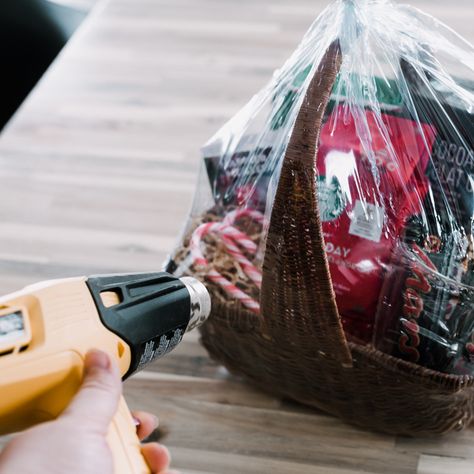 Learn how to shrink wrap a gift basket this holiday season to achieve  professional-like results! Get the job done quickly by using the Wagner FURNO heat gun. Wrap A Gift Basket, Gym Bag Diy, Making A Gift Basket, Heat Shrink Wrap, Wrap A Gift, Shrink Paper, Date Night Gifts, Gift Crates, Wrap Tutorial