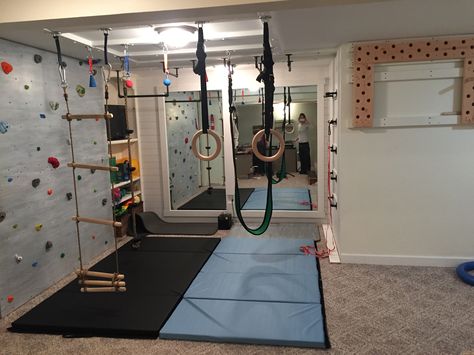 Indoor basement playground/ninja warrior gym/climbing wall/pegboard climber/indoor swing/gymnastic rings/chin-up bar Basement Playground, Wall Pegboard, Ninja Warrior Gym, Gym Basement, Basement Gym Ideas, Home Gym Basement, Basement Gym, Basement Playroom, Kids Basement