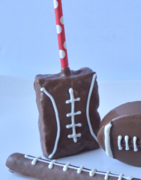 These football themed chocolate covered rice crispy treats are perfect for your next tailgate or football themed party. Comes as a set of 12 in each order. Pick from our delicious flavors of milk, dark, white, or colored chocolate for the base cookie covering. Each item will be individually wrapped and shipped in the appropriate box. Your chocolates will be freshly made upon order to ensure optimal freshness.  If you have any specific customization requests please leave them in the Order Instructions Box in your cart at checkout and we will contact you will any questions. Football Rice Krispie Treats Ideas, Football Theme Desserts, Chocolate Covered Rice Crispy Treats, Cake Puck, Football Themed Food, Chocolate Rice Crispy Treats, Chocolate Rice Crispy, Football Candy, Football Themed Party