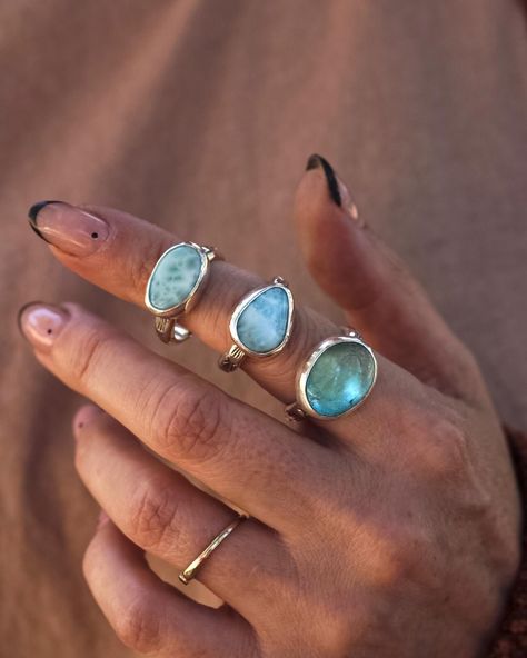 If the ocean wore rings🌊✨ From bottom to the top: Santa Maria Aquamarine, the birthstone for March. Aquamarine is Latin for “SEAWATER”. Larimar, found in the Dominican Republic. Known for its beautiful blue coloring and almost tie-dye look with white throughout. Both of these Larimar stones were cut by me, in my Northern California studio.  VALOR Collection 9/24 at 10am pst . . . . . #sustainablejewelry #bohojewelry #smallbusiness #riojeweler #jewelryobsessed #bohovibes #goddessjewelry Goddess Jewelry, White Spirit, Portfolio Ideas, Larimar Jewelry, Larimar Stone, Inspo Board, Xmas Ideas, The Dominican Republic, Sustainable Jewelry