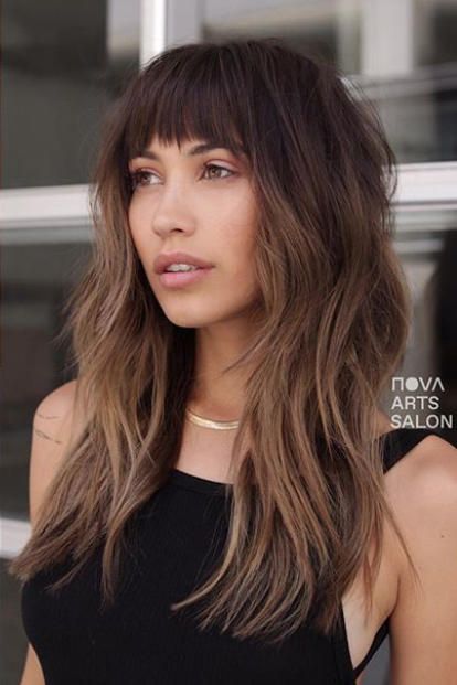 15 Stunning Examples of Melted Caramel Hair To Bring to Your Colorist This Fall | Take a walk on the dark side with this burnt caramel-inspired color. Pair it with a set of Jane Birkin bangs, and you're instantly the coolest girl in the room. #southernliving #haircolor #hairstyle Balayage Shag Hair Bangs, Balayage Shag Hair Long, Fall Haircuts 2022 Long, Haircut 2023 Trends Women Long Hair, Medium Long Haircut With Bangs, Long Womens Haircuts, Long Length Haircut For Thick Hair, Long Hair Shaggy Layers, Long Shag Haircut Straight Hair