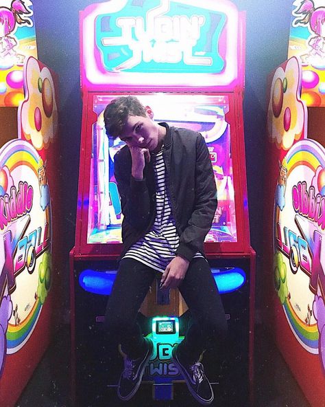 Arcade photoshoot with male model Fashion Poses Men, Neck Mobility, Arcade Shoot, Arcade Photoshoot, Neon Photoshoot, Male Model Photos, Photo Shoot Tips, Fashion Photography School, Poses Men