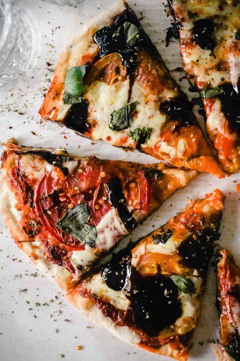 Everyone loves a classic Caprese Pizza! This Italian-inspired pie is topped with tomatoes, basil, mozzarella, and tangy balsamic glaze. Delicious, and so easy to make, too! #GratefulGrazer #CapresePizza #PizzaRecipe #Vegetarian Margarita Pizza With Balsamic Glaze, Caprese Pizza With Balsamic Glaze, Tomato Basil And Mozzarella, Caprese Pizza, Basil Mozzarella, Basil Pizza, Hearty Recipes, Margarita Pizza, Leftover Pizza