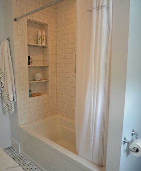 Large tile shower shelves at end of bathtub. Subway tile. Bathtub Shelves, Large Bathroom Storage, Remodel Bathtub, Tile Shower Shelf, Large Shower Tile, Tub Remodel, Bathtub Remodel, Large Bathroom, Hall Bathroom