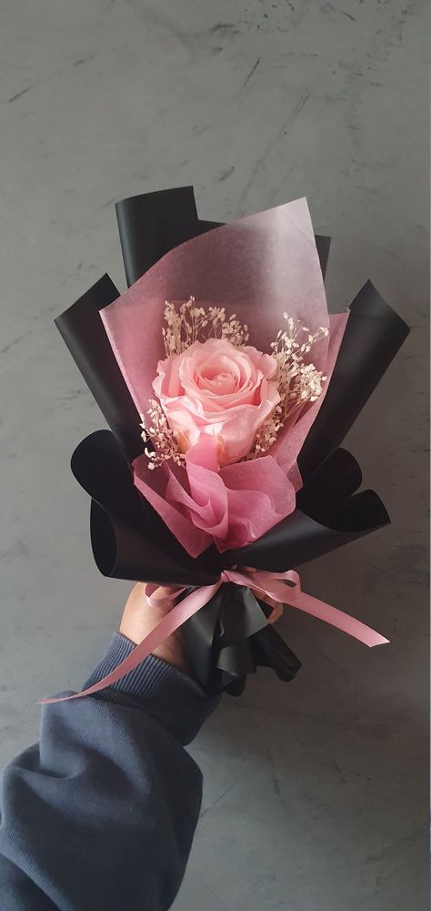 A single light pink rose with baby's breath wrapped in two different types of textured paper with a beautiful silk ribbon. The wrapping paper will be consisting mostly of black and then a coloured or white wax paper to allow the rose to stand out. The ribbon will match the existing rose.  This will make a great gift for any and all occ asions whether a birthday, anniversary, Mother's Day or simply any reason. More rose colours are to come over time. These flowers are made to last forever, or in Luxury Flowers Bouquet Gifts, Pink Bouquet Aesthetic, Bouquet Of Flowers Aesthetic, Rose Bouquet Gift, Ribbon Flowers Bouquet, Plant Arrangement, Luxury Flower Bouquets, Flower Bouquet Diy, Flower Gift Ideas