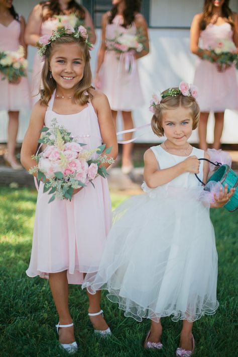 Junior bridesmaid wore a blush dress to match the rest of the bridesmaids with a blush rose and seeded eucalyptus bouquet. The flower girl wore a white dress and carried a turquoise pale. Seeded Eucalyptus Bouquet, Colorful Flower Crown, Bridesmaid Flower Crown, Rustic Pink Wedding, Flower Crown Bridesmaid, Bridesmaid Flower, Girls Dresses Online, Girls White Dress, White Flower Girl Dresses