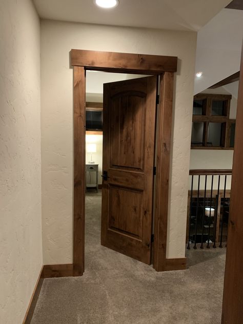 Hickory Doors And Trim, Trim In House Baseboards, Rustic Door Frame Ideas, Black House Trim Interior, Cabin Interior Doors And Trim, Rustic Moldings And Trim, Wood Trim Styles, Stained Trim Interior Farmhouse, Bedroom Door Trim